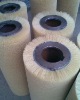 Corrugated nylon wearable brush roll