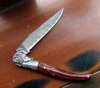 Damascus steel knife with wood handle
