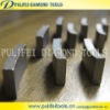 Diamond core bit segment for drilling reinforced concrete