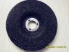 Grinding wheel for grinding metal