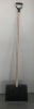 Plastic snow shovel with wooden handle