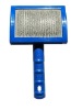 blue plastic dog brush