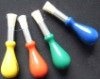 colored plastic handle and white China bristle artist brush