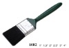 green-lacquered plastic hand and pure bristle painting brush