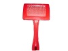 red plastic dog brush