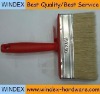 red wall paint brush