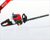 two-edged hedge trimmer machine in garden