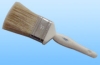 white bristle paint brush with plastic handle