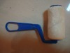 white mini roller brush with plastic handle