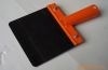 scraper with red steel handle